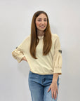 Maglia con maniche a sbuffo con gioielli