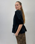 Maglia con dettaglio e balze con scollo a V