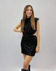 Abito corto con paillettes scollo schiena