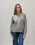 Maglione morbido con decorazioni frontali