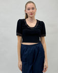 Maglia con decorazioni gioielli