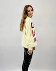 Maglione oversize con scritta love luck amor