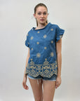 Maglia con ricami e volant