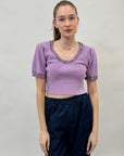 Maglia con decorazioni gioielli
