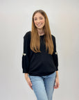 Maglia con maniche a sbuffo con gioielli