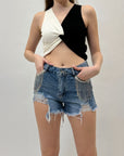 Pantaloncini con strappi e strass