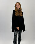 Pullover ampio con bottoni dietro