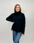 Maglione collo alto con frange