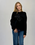 Maglione morbido con decorazioni frontali