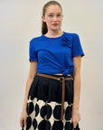 Maglia con nodo e fiore