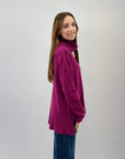 Maglione collo alto con frange