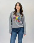 Maglione scritta wonderful in paillettes