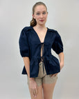 Maglia con dettaglio e balze con scollo a V