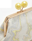 Borsa Clutch elegante con chiusura gioiello