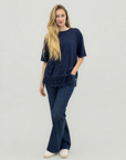 T-shirt over con inserto in pizzo sul fondo