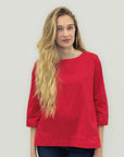 Blusa girocollo in cotone con manica a 3/4 e linea pulita