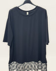 T-shirt over con inserto in pizzo sul fondo