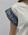 T-shirt in cotone con maniche decorate