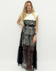 Abito lungo in pizzo trasparente effetto layering elegante