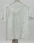Blusa ricamata con fiocco sul retro elegante e raffinata