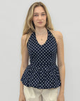 Top a pois con scollo all’americana e balza