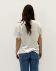 T-shirt con scritta "tutto o niente"