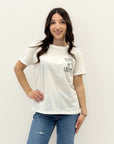 T-shirt con scritta "tutto o niente"