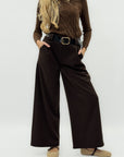 Pantaloni ampi in tessuto spigato con vita alta e linea elegante
