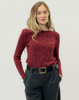 Maglia a treccia con dettagli classici