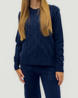 Completo maglia treccia e pantalone – Stile e comfort invernale
