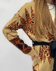 Cardigan fantasia etnica con cintura e frange
