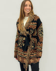 Cardigan fantasia etnica con cintura e frange