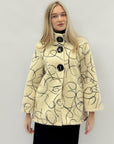 Cappotto fantasia con maxi bottoni – Stile elegante e ricercato