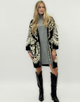 Cappotto in maglia jacquard con motivo floreale