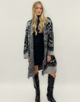 Cappotto jacquard con frange – Stile boho chic e calore avvolgente