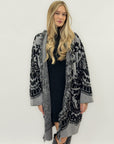 Cappotto jacquard con frange – Stile boho chic e calore avvolgente
