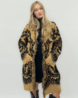Cappotto jacquard con frange – Stile boho chic e calore avvolgente