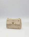 Borsa con borchie in paglia