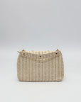 Borsa con borchie in paglia