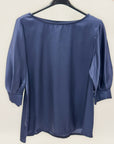 Blusa con maniche a sbuffo