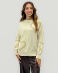 Maglione con cuori in rilievo – Morbidezza e romanticismo