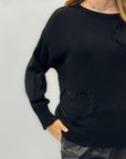 Maglione con cuori in rilievo – Morbidezza e romanticismo