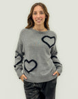Maglione con cuori in rilievo – Morbidezza e romanticismo