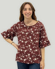 Blusa floreale con maniche a volant