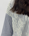 Camicia a righe con dettagli pizzo