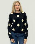 Maglione nero a pois bianchi – Stile moderno e morbida eleganza