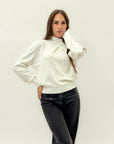 Maglione con perle applicate