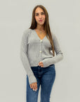 Cardigan corto a trecce con bottoni gioiello