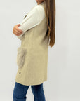 Gilet lungo con tasche in ecopelliccia