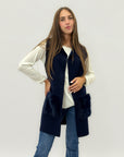 Gilet lungo con tasche in ecopelliccia